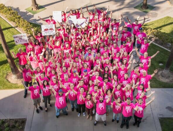 Top view of Scorpion employees wearing pink shirts